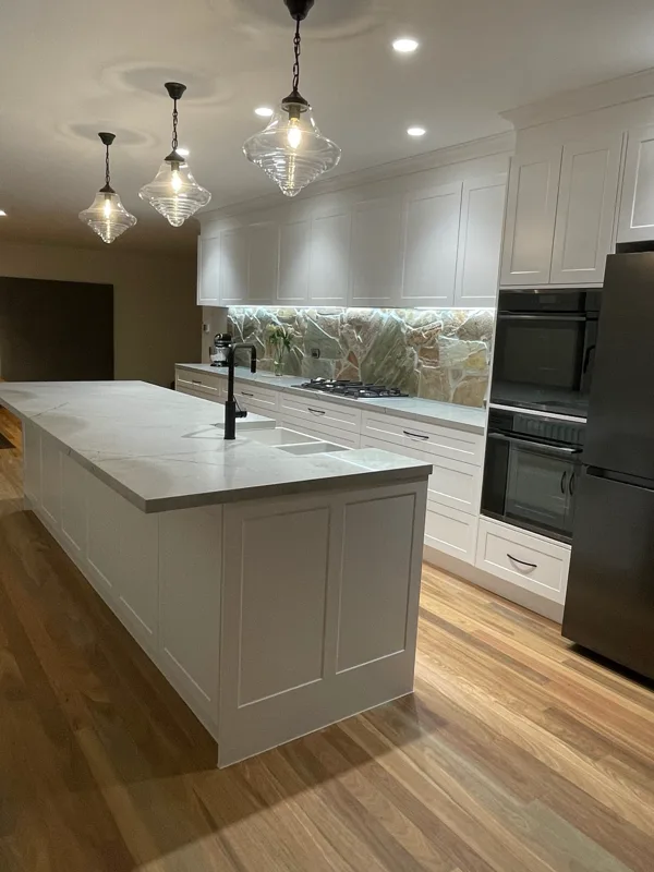 Renovated open-plan kitchen and living space in a completed JTD home renovation