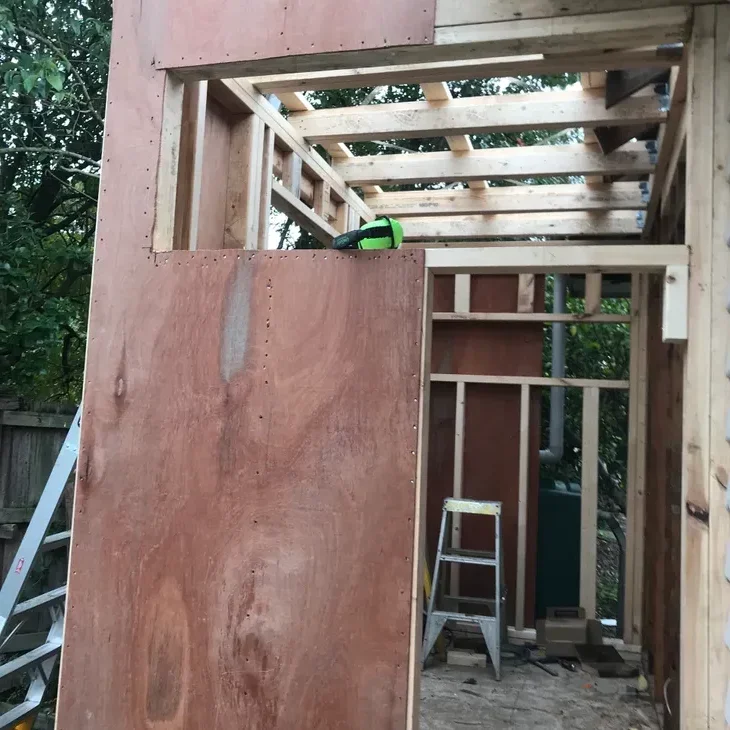 Structural plywood and roof framing on a JTD extension in progress